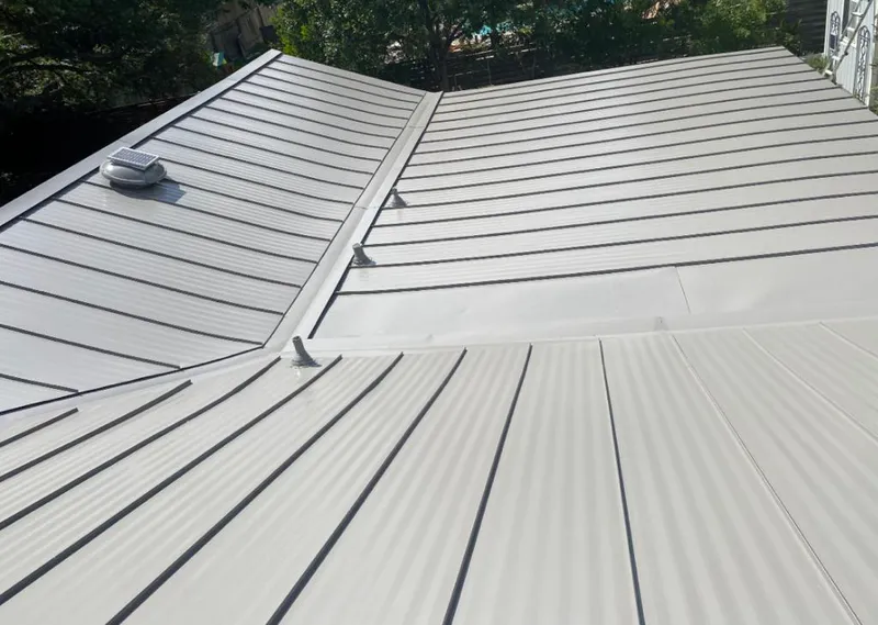 Solar attic fan installed on a metal roof for Roof Ventilation in Prineville